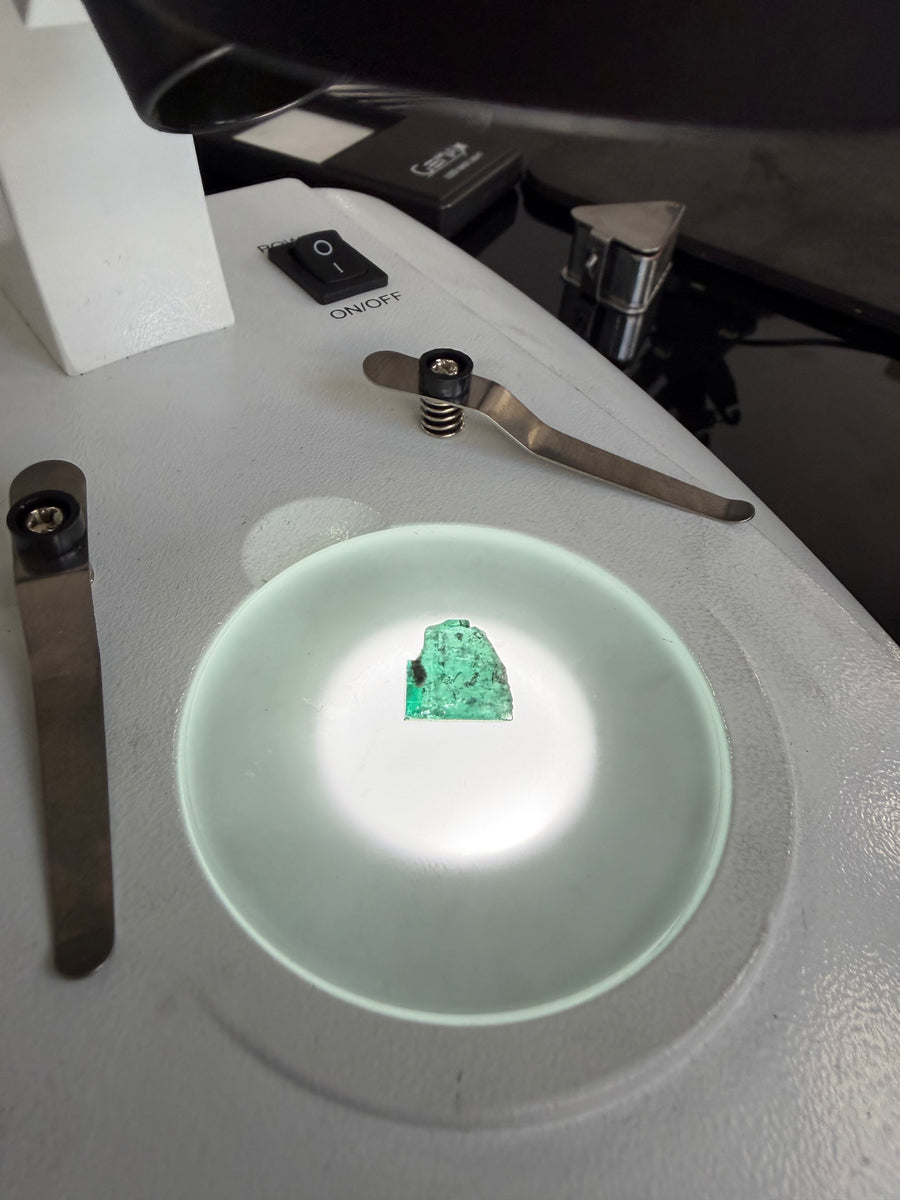 Cut emerald on a lit examination dish